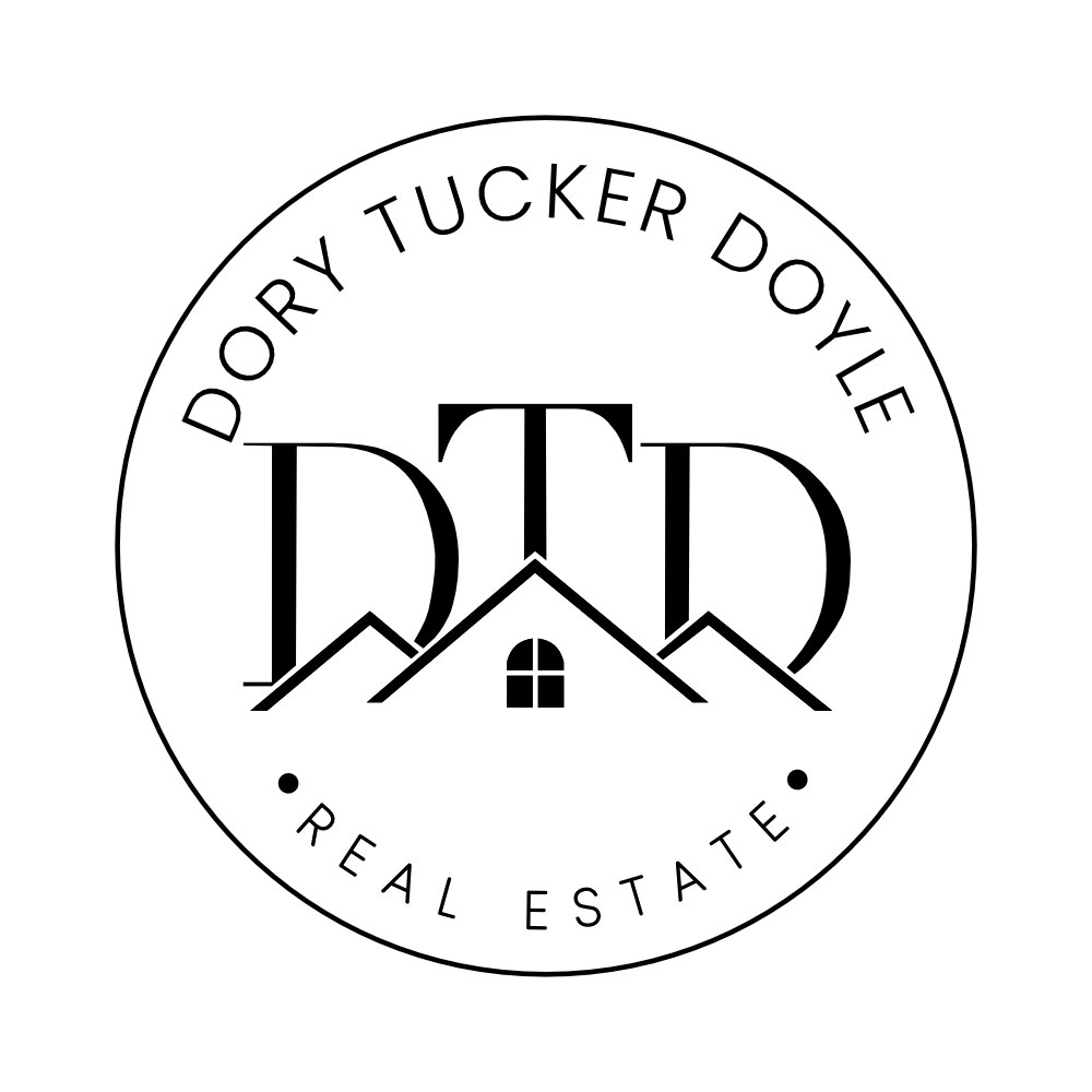 DTD variant 4: circular seal with Dory Tucker Doyle arcing above and Real Estate below